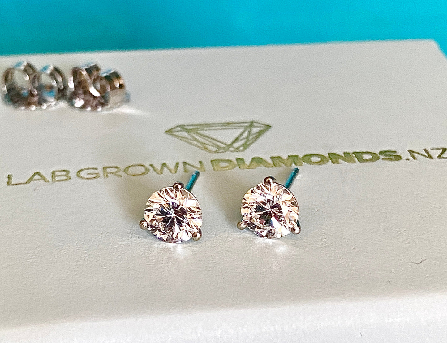 Stylish lab-grown diamond ring with a radiant round-cut center stone on a polished band